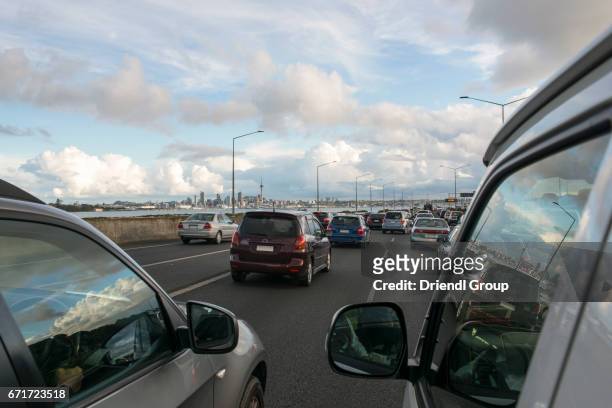 view of auckland skyline from a car in rush hour traffic. - auckland new zealand stock pictures, royalty-free photos & images