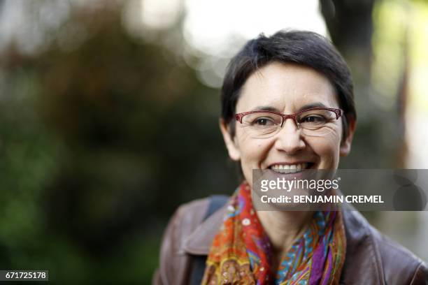 French presidential election candidate for the far-left Lutte Ouvriere party Nathalie Arthaud smiles outside a polling station in Pantin, northeast...