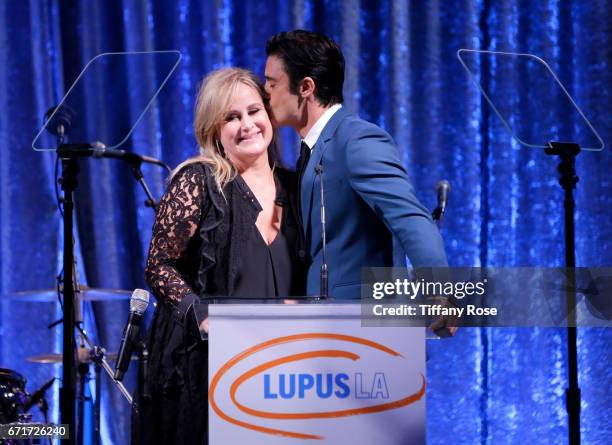 Philanthropist Kelly Stone and actor Gilles Marini speak onstage at Lupus LA's Orange Ball: Rocket to a Cure at the California Science Center on...