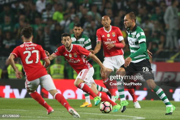 Sporting's Dutch forward Bas Dost vies with Benfica's Portuguese forward Pizzi and Benfica's Portuguese midfielder Rafa Silva during the Portuguese...