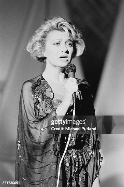 English singer and actress Elaine Paige performing, December 1984.