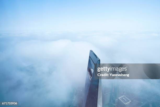 Shanghai World Finance center building in the fog,this building ,along with Jinmal building and Oriental Pear Tower are landmark of Shanghai city,located at Pudong area