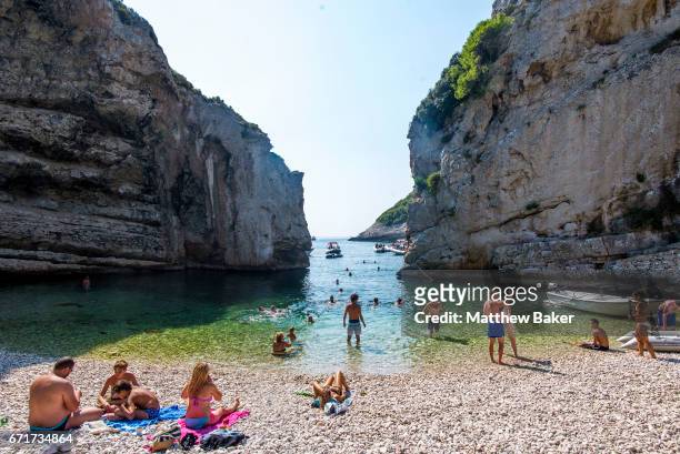 General view of tourists swimming and sunbathing on Stiniva beach on September 2, 2016 in Vis, Croatia.