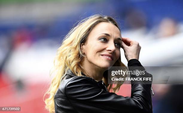 French TV host Laurie Delhos­tal reacts before the French L1 football match between Paris Saint-Germain and Montpellier at the Parc des Princes...