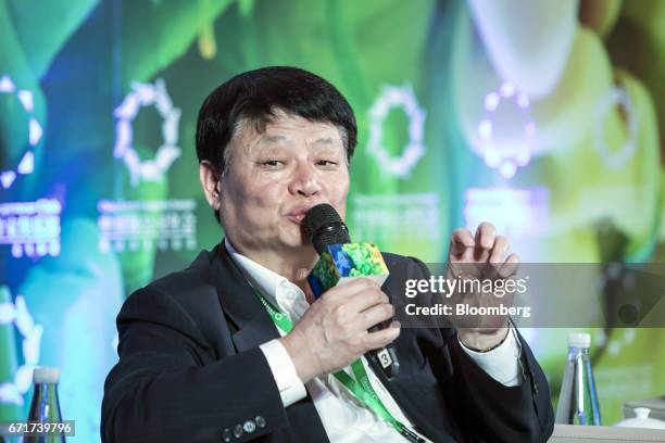 Hong Qi, chairman of China Minsheng Banking Corp., speaks during a session at the China Green Companies Summit in Zhengzhou, China, on Sunday, April...