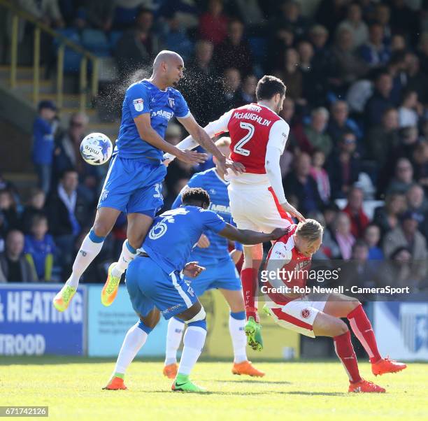 Gillingham's Zesh Rehman and Fleetwood Town's Conor McLaughlin challenge for the ball during the Sky Bet League One match between Gillingham and...