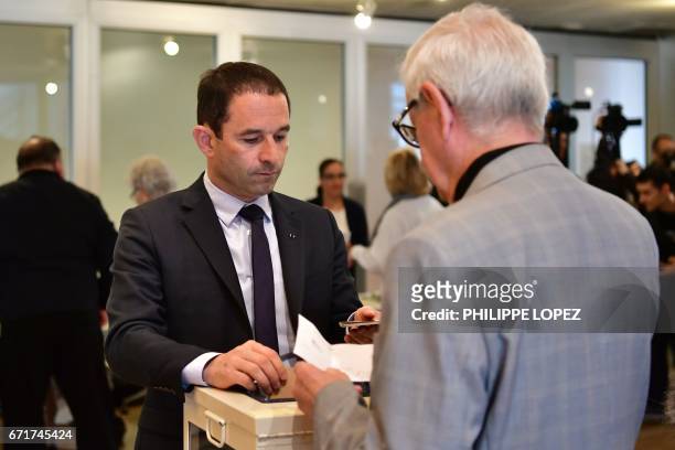 French presidential election candidate for the left-wing French Socialist party Benoit Hamon casts his ballot at a polling station in Trappes, Paris'...