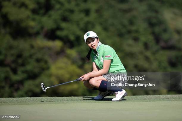 Kotone Hori of Japan reacts after a putt on the 18th green during the final round of Fujisankei Ladies Classic at the Kawana Hotel Golf Course Fuji...