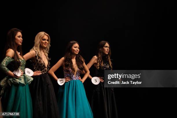 Contestants line up during the 'Intellectual Contest' at the grand final of Miss USSR UK at the Troxy on April 22, 2017 in London, England. The...