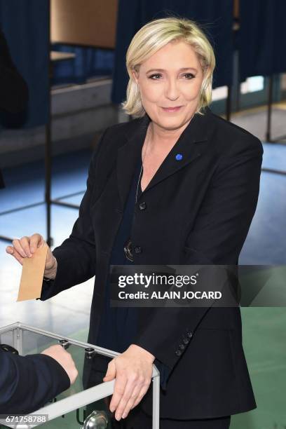 French presidential election candidate for the far-right Front National party Marine Le Pen casts her ballot at a polling station in Henin-Beaumont,...