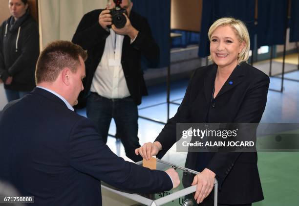 French presidential election candidate for the far-right Front National party Marine Le Pen casts her ballot at a polling station in Henin-Beaumont,...