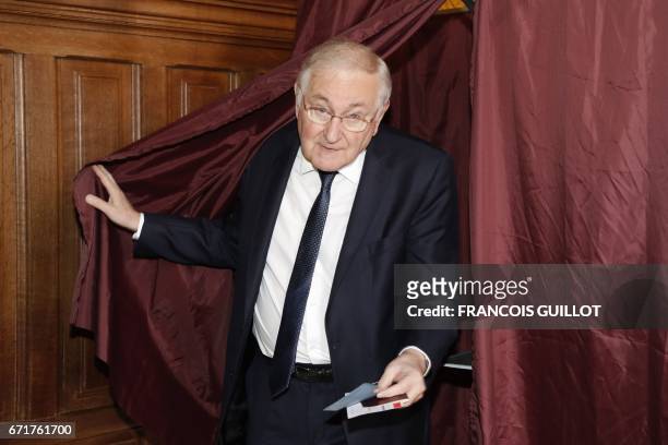 French presidential election candidate for the Solidarite et Progres party Jacques Cheminade exits a booth before casting his ballot at a polling...