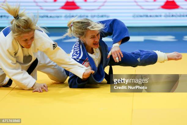 Eva Csernoviczki , Maryna Cherniak , compete during the European Judo Championships in Warsaw, April 20, 2017.