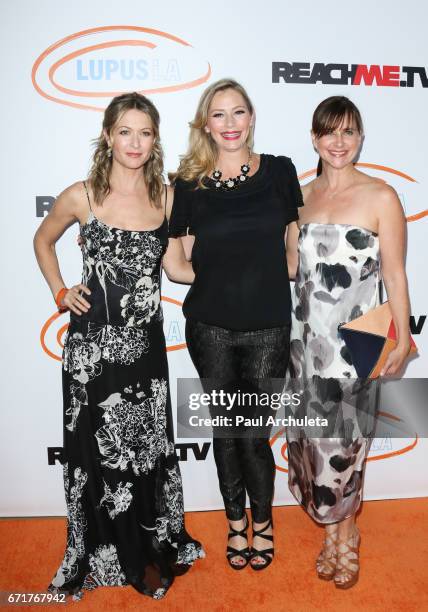 Actors Ali Hillis, Meredith Monroe and Kellie Martin attend the Lupus LA's 2017 Orange Ball: Rocket To A Cure at The California Science Center on...