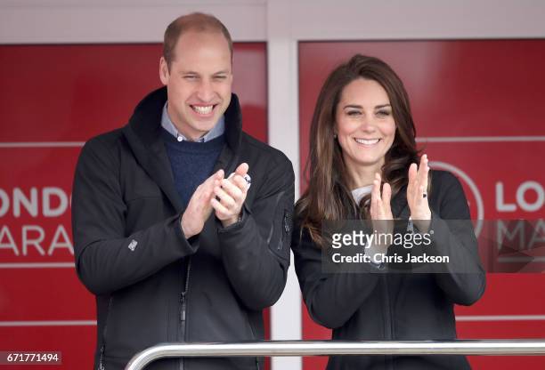 Prince William, Duke of Cambridge and Catherine, Duchess of Cambridge cheer on runners as they signal the start of the 2017 Virgin Money London...