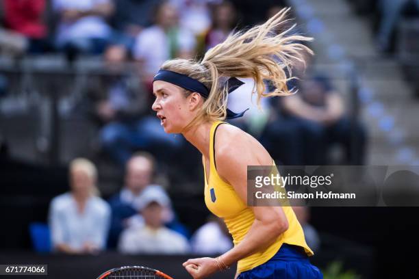 Elina Svitolina of Ukraine celebrates a point against Angelique Kerber of Germany during the FedCup World Group Play-Off match between Germany and...