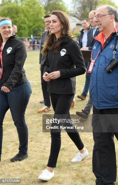 Catherine, Duchess of Cambridge meets Heads Together runners in the Blue Start area as they prepare for the 2017 Virgin Money London Marathon on...