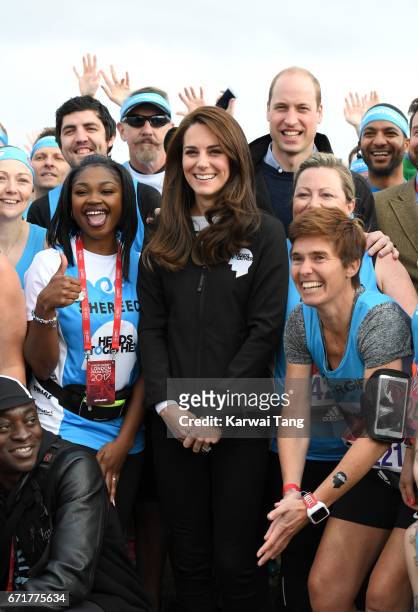 Catherine, Duchess of Cambridge and Prince William, Duke of Cambridge meet Heads Together runners in the Blue Start area as they prepare for the 2017...