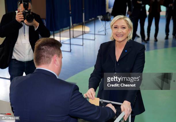 French far-right Front National party's President Marine Le Pen casts her ballot for the French Presidential elections in a polling station on April...