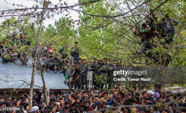 Kashmiri Muslims gather to attend the funeral procession of Younis Maqbool Ganie, a pro Kashmir rebel killed in a gun battle with Indian government...