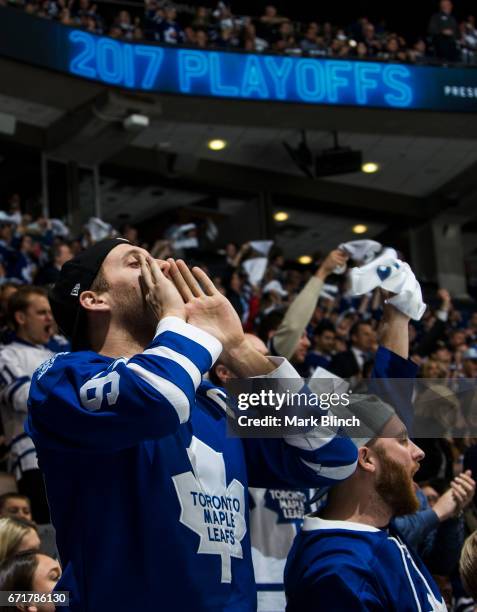 Fans cheer while the Toronto Maple Leafs play the Washington Capitals during the third period in Game Four of the Eastern Conference First Round...