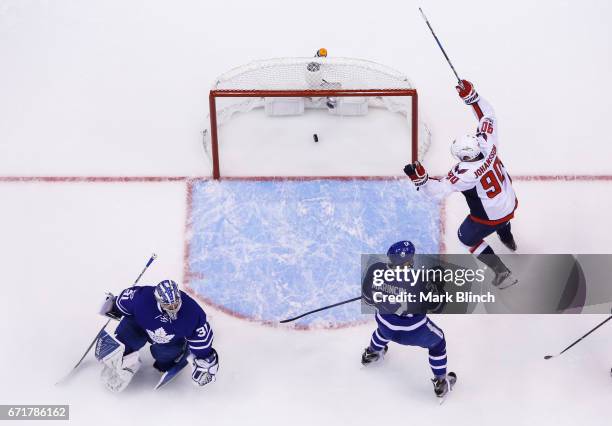 Marcus Johansson of the Washington Capitals celebrates a goal by teammate Alex Ovechkin against Frederik Andersen and Martin Marincin during the...