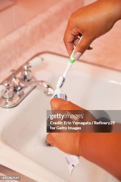 young woman brushing teeth - 67percentcollection bildbanksfoton och bilder