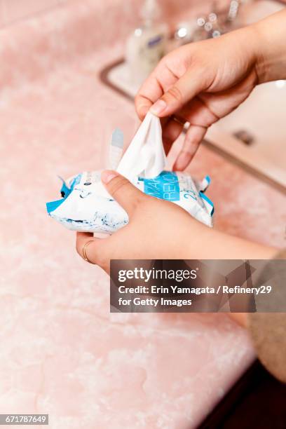 young woman holding makeup remover - 67percentcollection bildbanksfoton och bilder