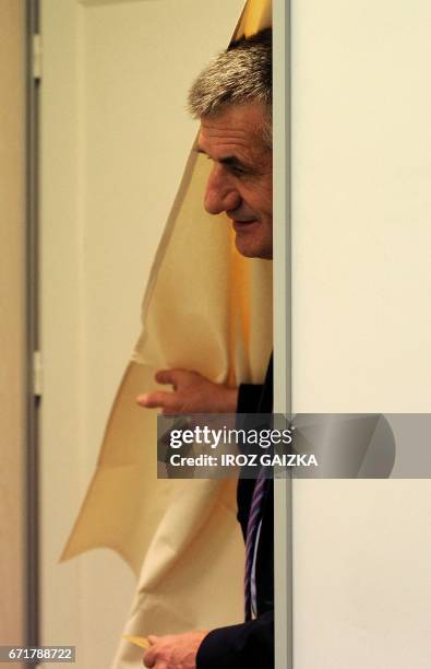 French lawmaker and independent candidate for French presidential election Jean Lassalle leaves the polling booth as he prepares to cast his ballot...