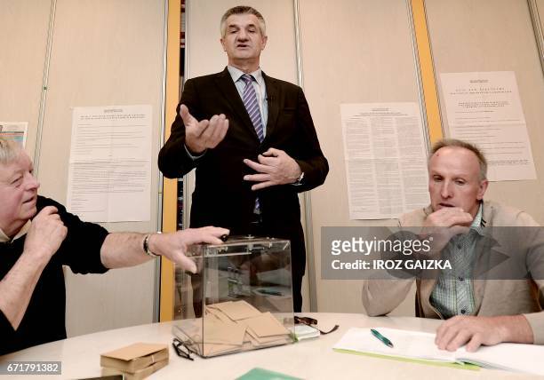 French lawmaker and independent candidate for French presidential election Jean Lassalle gestures as he prepares to cast his ballot in...