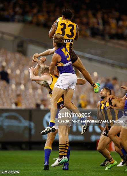 Cyril Rioli of the Hawks takes a spectacular mark over Nathan Vardy of the Eagles during the 2017 AFL round 05 match between the Hawthorn Hawks and...