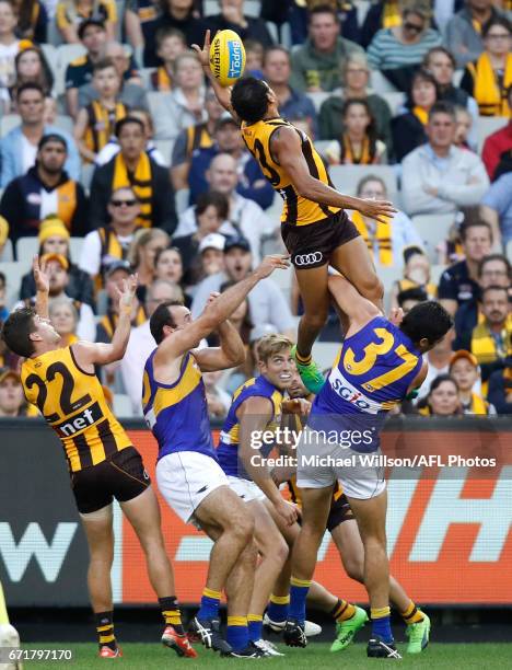 Cyril Rioli of the Hawks attempts a spectacular mark over Tom Barrass of the Eagles during the 2017 AFL round 05 match between the Hawthorn Hawks and...