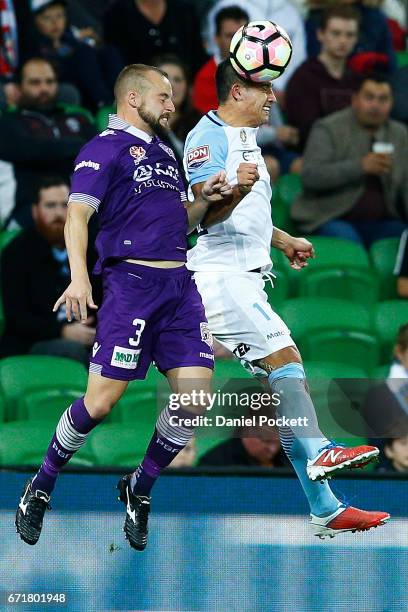 Tim Cahill of Melbourne City and Marc Warren of the Glory contest the ball during the A-League Elimination Final match between Melbourne City FC and...