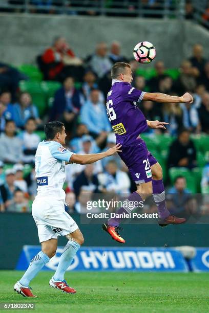 Lucian Goian of the Glory and Tim Cahill of Melbourne City contest the ball during the A-League Elimination Final match between Melbourne City FC and...