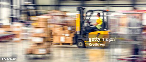 forklift in warehouse - forklift truck stock pictures, royalty-free photos & images