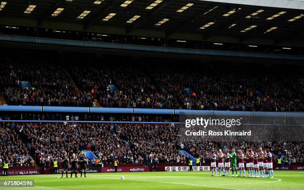 Players stand at the minute of applaud for Ugo Ehiogu prior to the Sky Bet Championship match between Aston Villa and Birmingham City at Villa Park...