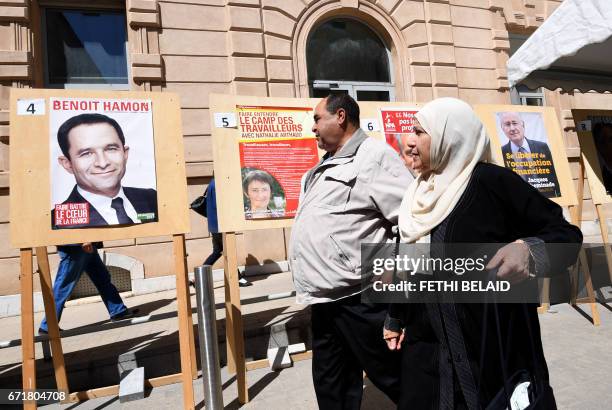 French nationals residing in Tunisia arrive to cast their vote for the first round of the French presidential election on April 23 at the French...