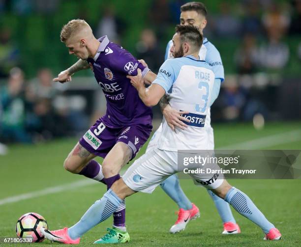 Andrew Keogh of Perth Glory and Josh Rose of Melbourne City compete for the ball during the A-League Elimination Final match between Melbourne City...