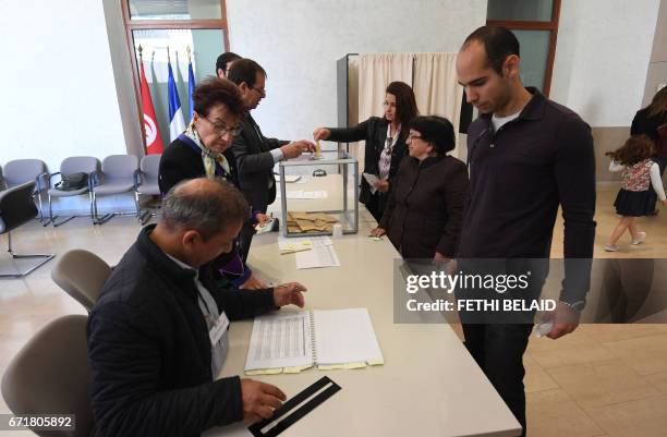 French nationals residing in Tunisia cast their vote for the first round of the French presidential election on April 23 at the French embassy in...