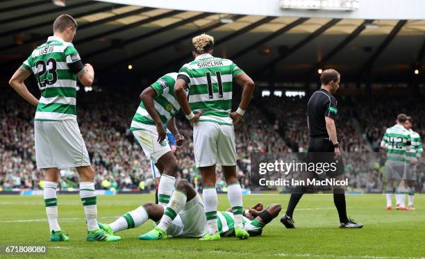 Moussa Dembele of Celtic lies injured during the Scottish Cup Semi-Final match between Celtic and Rangers at Hampden Park on April 23, 2017 in...