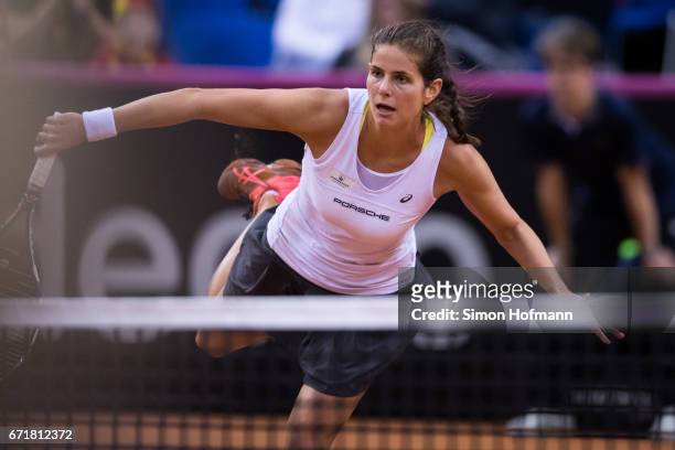 Julia Goerges of Germany returns the ball against Lesia Tsurenko of Ukraine during the FedCup World Group Play-Off match between Germany and Ukraine...