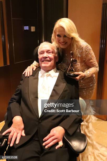 Kerri-Anne Kennerley and her husband John Kennerley pose with the Hall Of Fame Logie Award during the 59th Annual Logie Awards at Crown Palladium on...