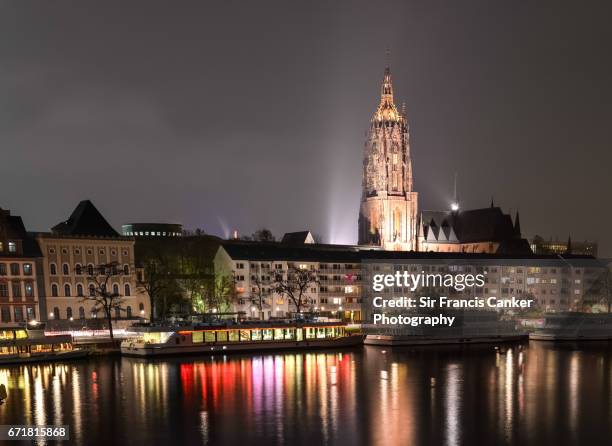 cathedral of saint bartholomew and reflections on river main waterfront in frankfurt, germany - imperial cathedral of saint bartholomew stock pictures, royalty-free photos & images