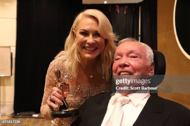 Kerri-Anne Kennerley and her husband John Kennerley pose with the Hall Of Fame Logie Award during the 59th Annual Logie Awards at Crown Palladium on...