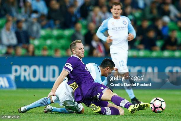 Rostyn Griffiths of the Glory and Tim Cahill of Melbourne City compete for the ball during the A-League Elimination Final match between Melbourne...