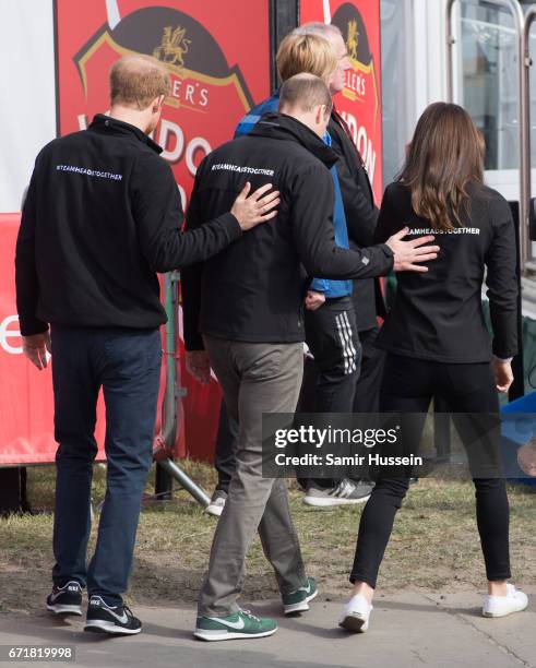 Prince Harry, Prince William, Duke of Cambridge and Catherine, Duchess of Cambridge walk off together after starting the 2017 Virgin Money London...