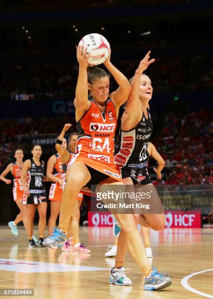 Sarah Wall of the Giants is challenged by April Brandley of the Magpies during the round nine Super Netball match between the Giants and the Magpies...