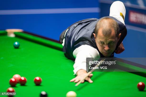 Graeme Dott of Scotland plays a shot during his second round match against Barry Hawkins of England on day nine of Betfred World Championship 2017 at...