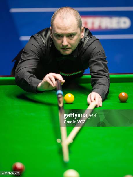 Barry Hawkins of England plays a shot during his second round match against Graeme Dott of Scotland on day nine of Betfred World Championship 2017 at...