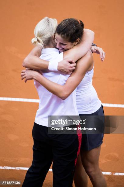 Julia Goerges of Germany celebrates victory against Lesia Tsurenko of Ukraine with head coach Barbara Rittner during the FedCup World Group Play-Off...